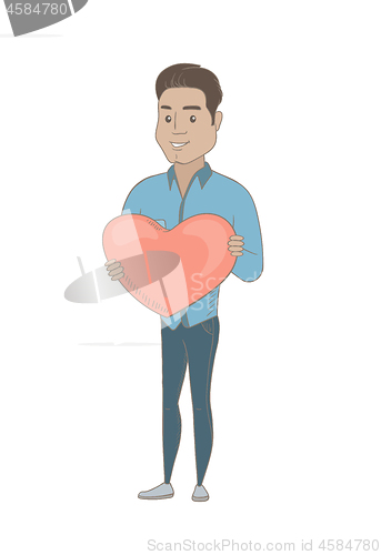 Image of Hispanic businessman holding a big red heart.