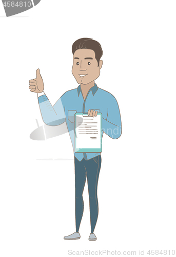 Image of Young businessman with clipboard giving thumb up.