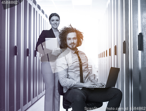 Image of Team of young technicians working together on servers