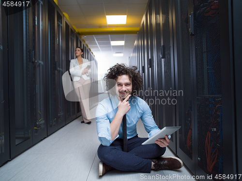 Image of young technicians working together on servers