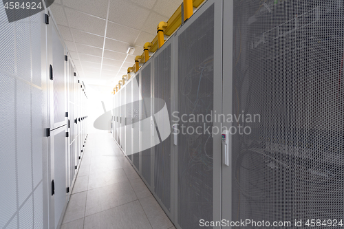 Image of modern server room with white servers