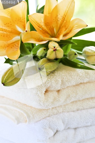 Image of Stack of towels with flowers