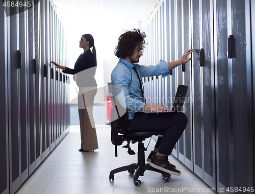 Image of technicians working together on servers