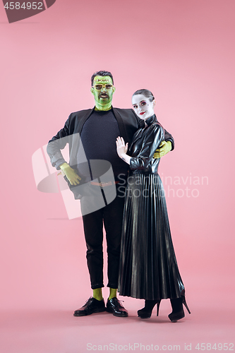 Image of Halloween Family. Happy couple in Halloween Costume and Makeup