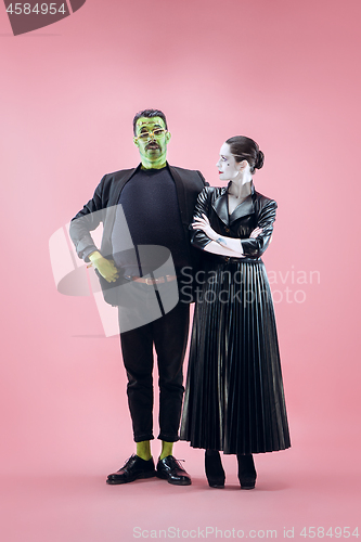 Image of Halloween Family. Happy couple in Halloween Costume and Makeup