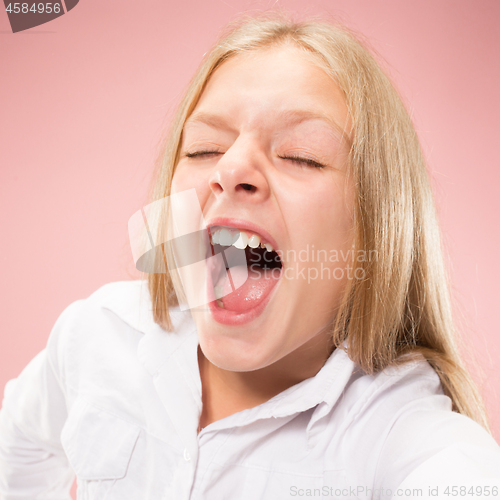 Image of Isolated on pink young casual teen girl shouting at studio