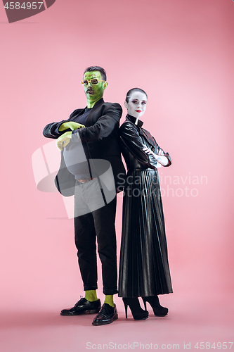 Image of Halloween Family. Happy couple in Halloween Costume and Makeup