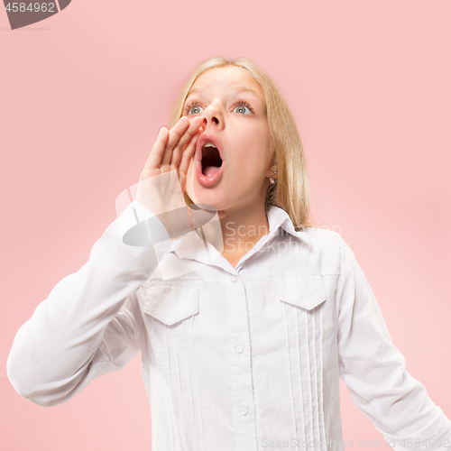 Image of Isolated on pink young casual teen girl shouting at studio