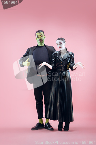 Image of Halloween Family. Happy couple in Halloween Costume and Makeup