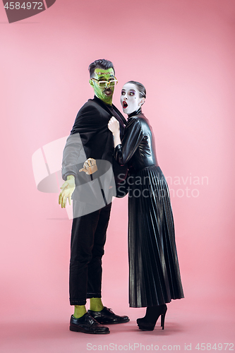 Image of Halloween Family. Happy couple in Halloween Costume and Makeup