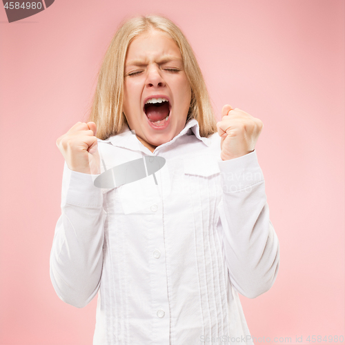 Image of Isolated on pink young casual teen girl shouting at studio