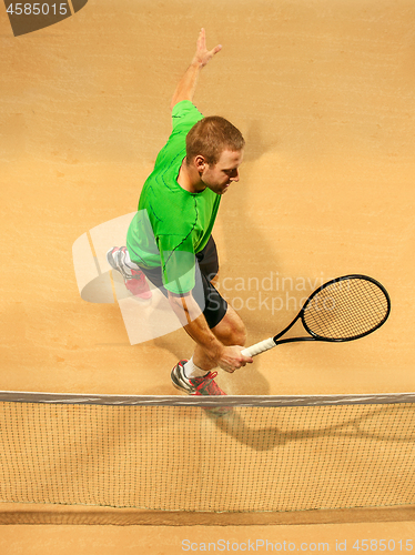 Image of The one jumping player, caucasian fit man, playing tennis on the