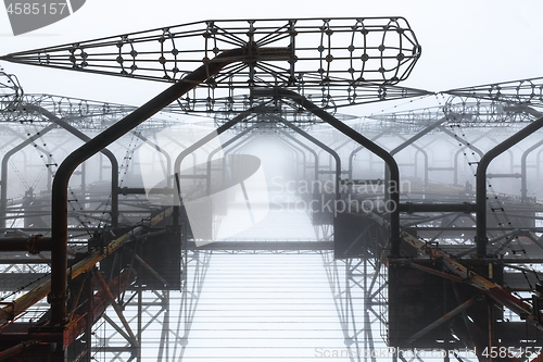 Image of Large radar antenna in the fog