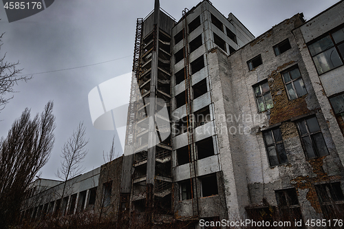 Image of Large factory exterior in the fog