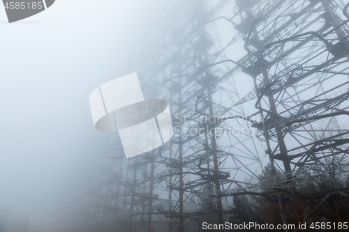 Image of Large radar antenna in the fog