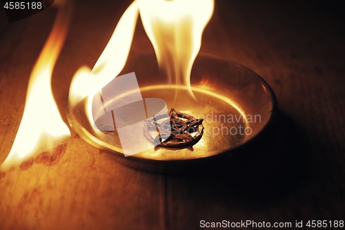 Image of Old pentagram burning in flames