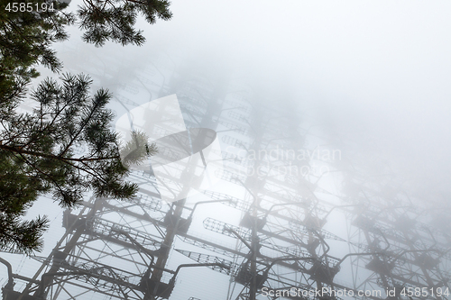 Image of Large radar antenna in the fog