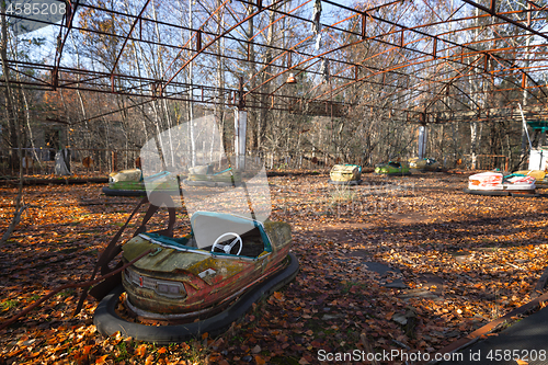 Image of Old cart in abandoned amusement park