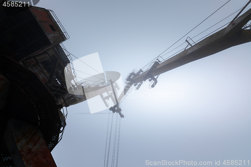 Image of Rusty old industrial dock cranes at the Dock