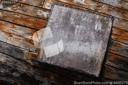 Image of Peeling brown plank background texture