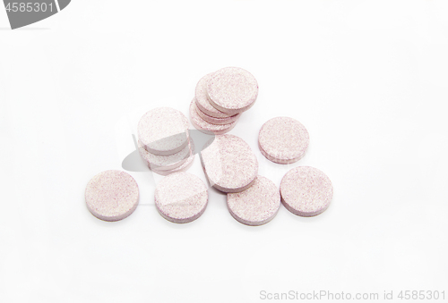 Image of Heap of pink water soluble vitamins on white