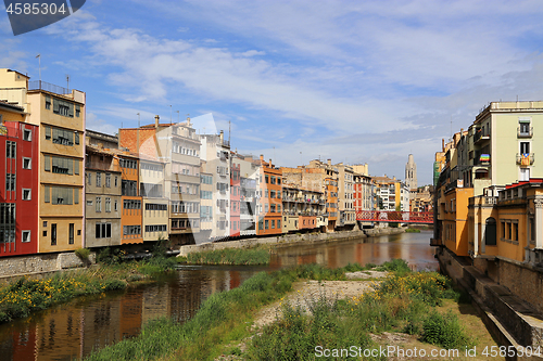 Image of Colorful houses and Eiffel bridge on river Onyar in Girona