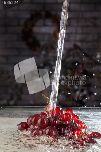 Image of Bunch Of Grapes And Water Stream