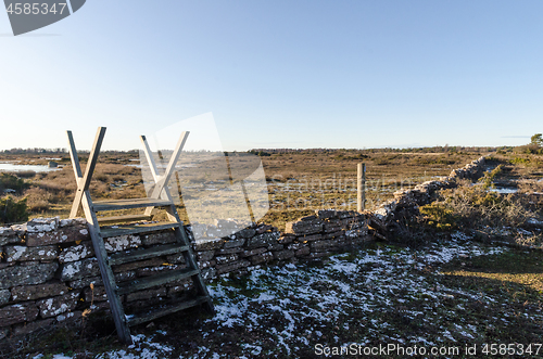 Image of Wooden stile across an old dry stone wall