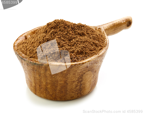 Image of cinnamon in wooden cup