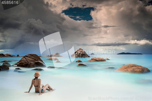 Image of Woman relaxing at the beach