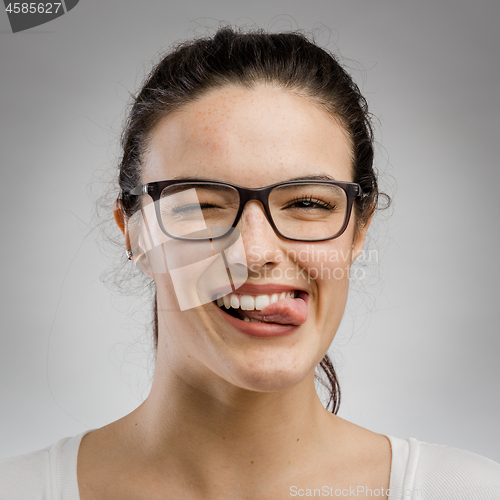 Image of Woman biting her tongue