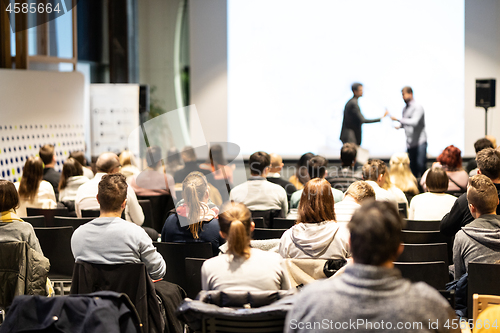 Image of Business speakers giving a talk at business conference event.