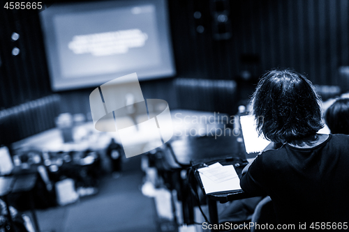 Image of Audience in the lecture hall attending business conference event.