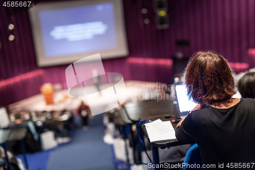 Image of Audience in the lecture hall attending business conference event.