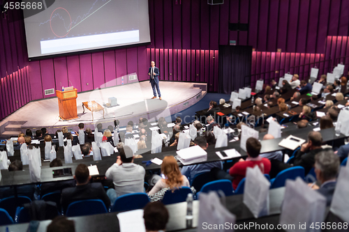 Image of Speaker giving presentation on business conference event.