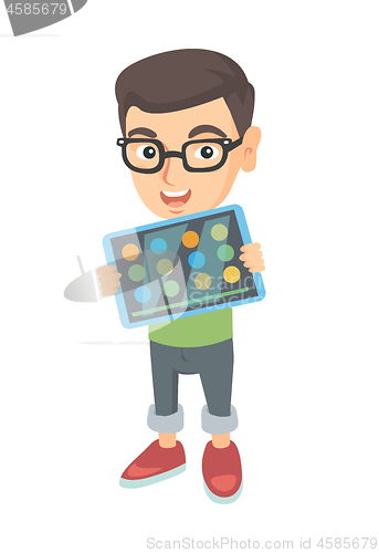Image of Caucasian boy playing game on a tablet computer.