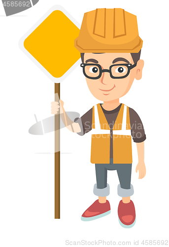 Image of Little caucasian builder boy holding road sign.