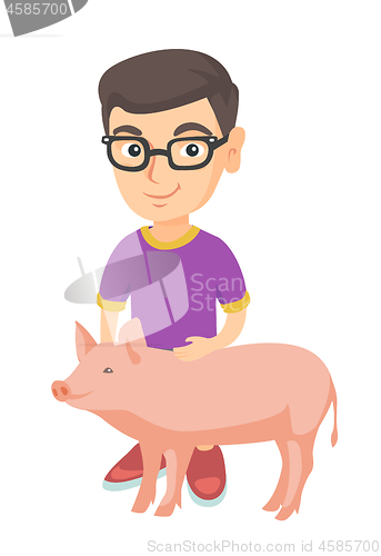 Image of Caucasian farmer boy in glasses stroking a pig.