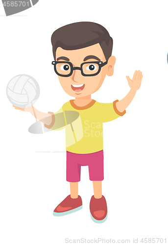 Image of Little caucasian boy holding a volleyball ball.