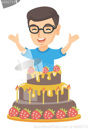 Image of Little caucasian boy jumping out of a large cake.