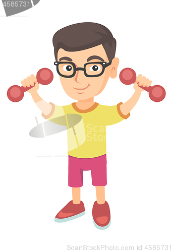 Image of Little smiling caucasian boy holding dumbbells.