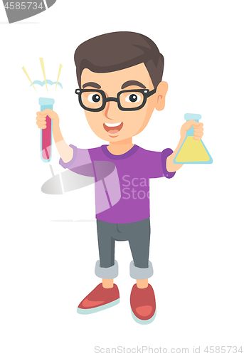 Image of Little caucasian boy holding test tube and beaker.