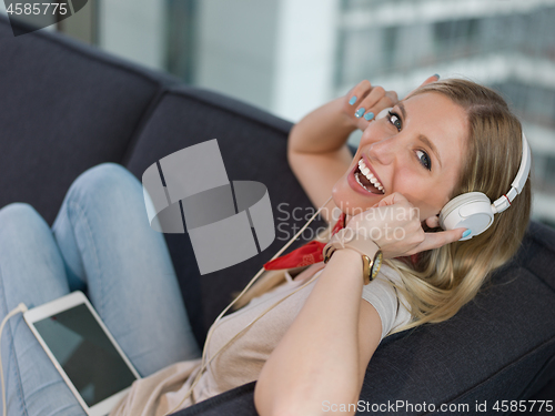 Image of girl enjoying music through headphones