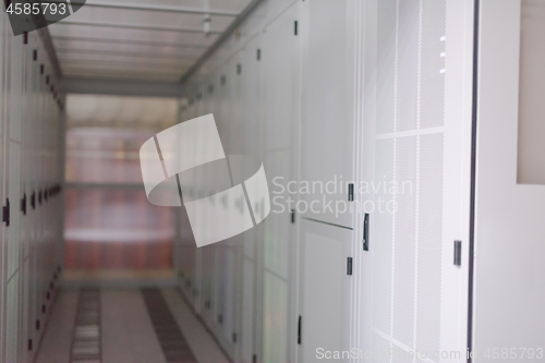 Image of modern server room with white servers