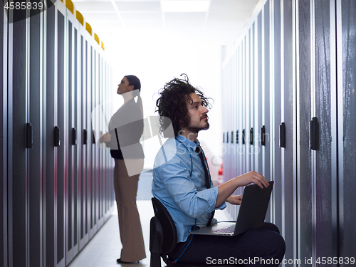 Image of technicians working together on servers