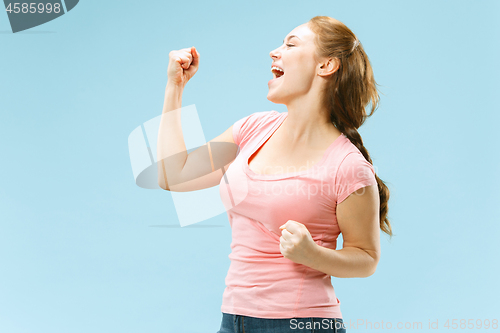 Image of Winning success woman happy ecstatic celebrating being a winner. Dynamic energetic image of female model