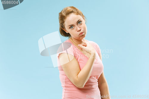 Image of Beautiful bored woman bored isolated on blue background