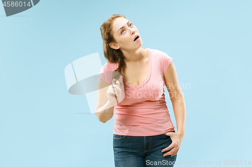 Image of Beautiful bored woman bored isolated on blue background