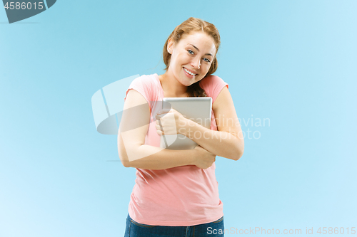 Image of Businesswoman hugging laptop. Love to computer concept.