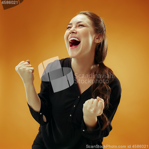 Image of Winning success woman happy ecstatic celebrating being a winner. Dynamic energetic image of female model